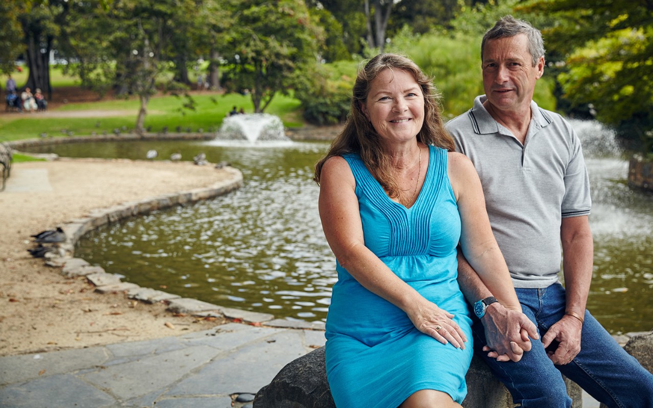 Couple sitting by a pond